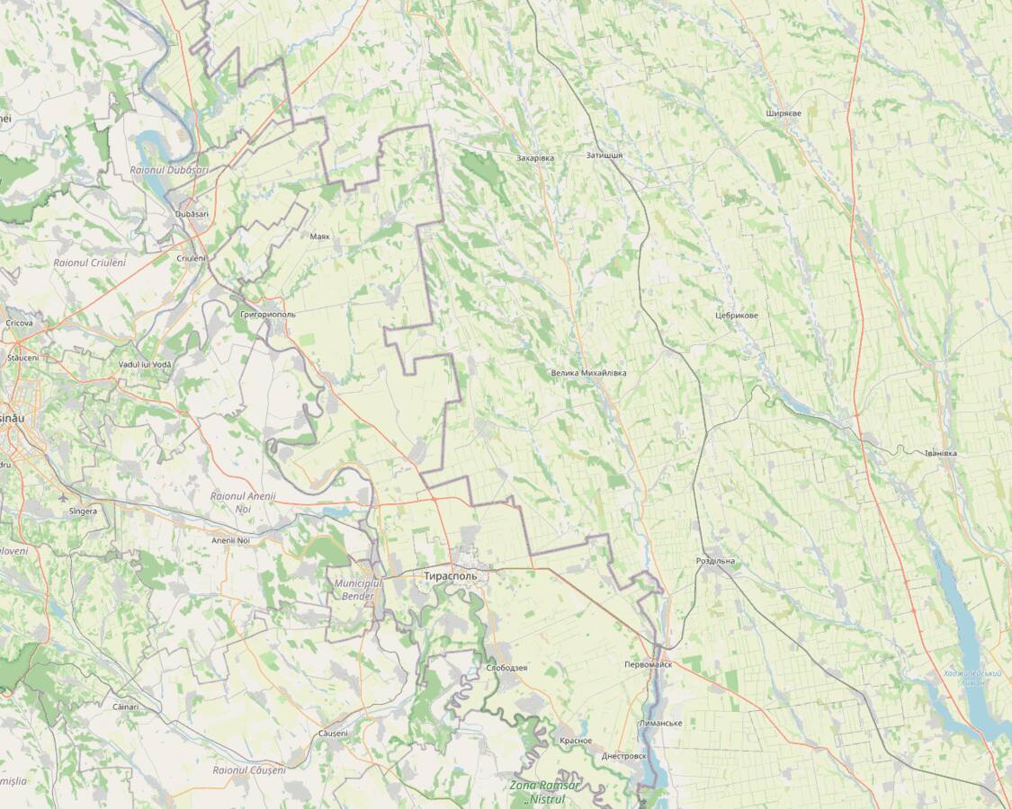 OpenStreetMap region around Tiraspol and Bender on the Dniester river, showing the de-facto border with Moldova proper and the road east to Ukraine.